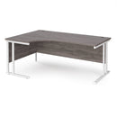 Dams Maestro 25 ergonomic desk with cantilever leg in grey oak finish, shown from the left side.