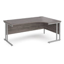 Dams Maestro 25 ergonomic desk with grey oak finish and cantilever leg, shown from the right side, ideal for modern office setups.