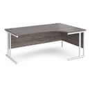 Dams Maestro 25 ergonomic desk with grey oak finish and cantilever leg, shown from the right side, featuring sleek modern design.