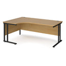Dams Maestro 25 ergonomic oak desk with black finish and cantilever legs, shown from the left side.