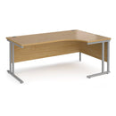 Dams Maestro 25 ergonomic desk with oak top and silver cantilever legs, right-hand view showing spacious workspace.