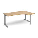Dams TR10 ergonomic oak desk with sleek wooden surface and sturdy metal legs, ideal for modern home or office workspace.