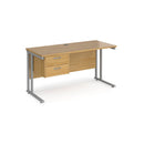 Dams Maestro 25 straight oak and silver desk with 600mm depth, fixed 2-drawer pedestal, and cantilever legs.