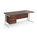Dams Maestro 25 straight desk in walnut and white with 800mm depth, fixed three-drawer pedestal, and cantilever legs.