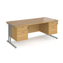 Dams Maestro 25 straight desk with oak silver finish, 1800mm long, 800mm deep, featuring two fixed 2-drawer pedestals and cantilever legs.