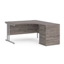 Dams Maestro 25 ergonomic desk with grey oak finish and matching high pedestal, right-hand configuration, 1400mm length.