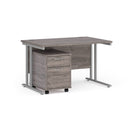 Dams Maestro 25 grey oak straight desk with two-drawer under desk pedestal in silver finish, ideal for modern office workspace.
