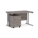 Dams Maestro 25 grey oak straight desk with 3-drawer under-desk pedestal in silver finish, modern office workspace setup.