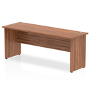 Impulse 600mm deep straight desk with panel legs in walnut finish, designed by Dynamic, showing a modern office workspace.