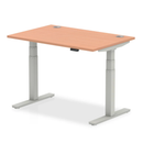 Dynamic Air 800mm deep height adjustable desk with cable ports in beech finish, showing the sleek beech surface and cable management features.