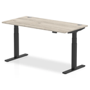 Deep grey oak height-adjustable desk with cable ports from Dynamic, featuring an 800mm depth and modern design.