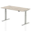 Grey oak Air 800mm deep height adjustable desk with cable ports by Dynamic, featuring a modern design and ergonomic workspace.