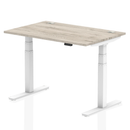 Dynamic Air 800mm deep height adjustable desk in grey oak with cable ports, featuring a sleek modern design and ergonomic functionality.