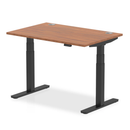 Dynamic Air 800mm deep height-adjustable walnut desk with cable ports, featuring a sleek modern design and sturdy construction.