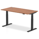 Deep walnut adjustable desk by Dynamic with 800mm height, cable ports, and a sturdy design for ergonomic workspace setup.
