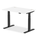 White Dynamic Air 800mm deep height adjustable desk with cable ports and black legs, featuring a modern office workspace design.