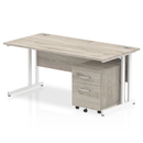 Grey oak Impulse cantilever straight desk with two-drawer mobile pedestal by Dynamic, featuring a modern office workspace setup.