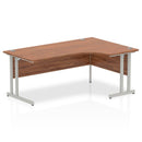 Impulse crescent desk with cantilever leg in walnut finish by Dynamic, featuring a sleek modern design and silver accents.
