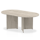 Grey oak Impulse Boardroom Table with Arrowhead legs by Dynamic, showcasing a modern conference table design.