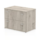 Grey oak Impulse side filing cabinet by Dynamic with multiple drawers for office storage.