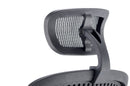 Black mesh Mirage II Executive Chair by Dynamic with armrests and headrest, featuring ergonomic design and adjustable features.