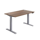 TC Office Economy Sit Stand Desk in walnut and silver finish, 1200mm wide, adjustable height for ergonomic workspace.